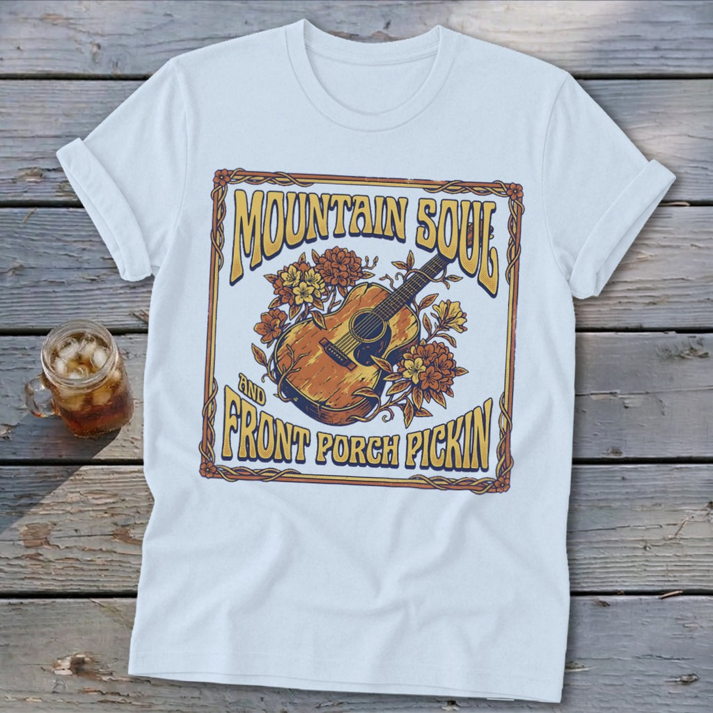 White t-shirt with "Mountain Soul and Front Porch Pickin'" graphic featuring a guitar and flowers.