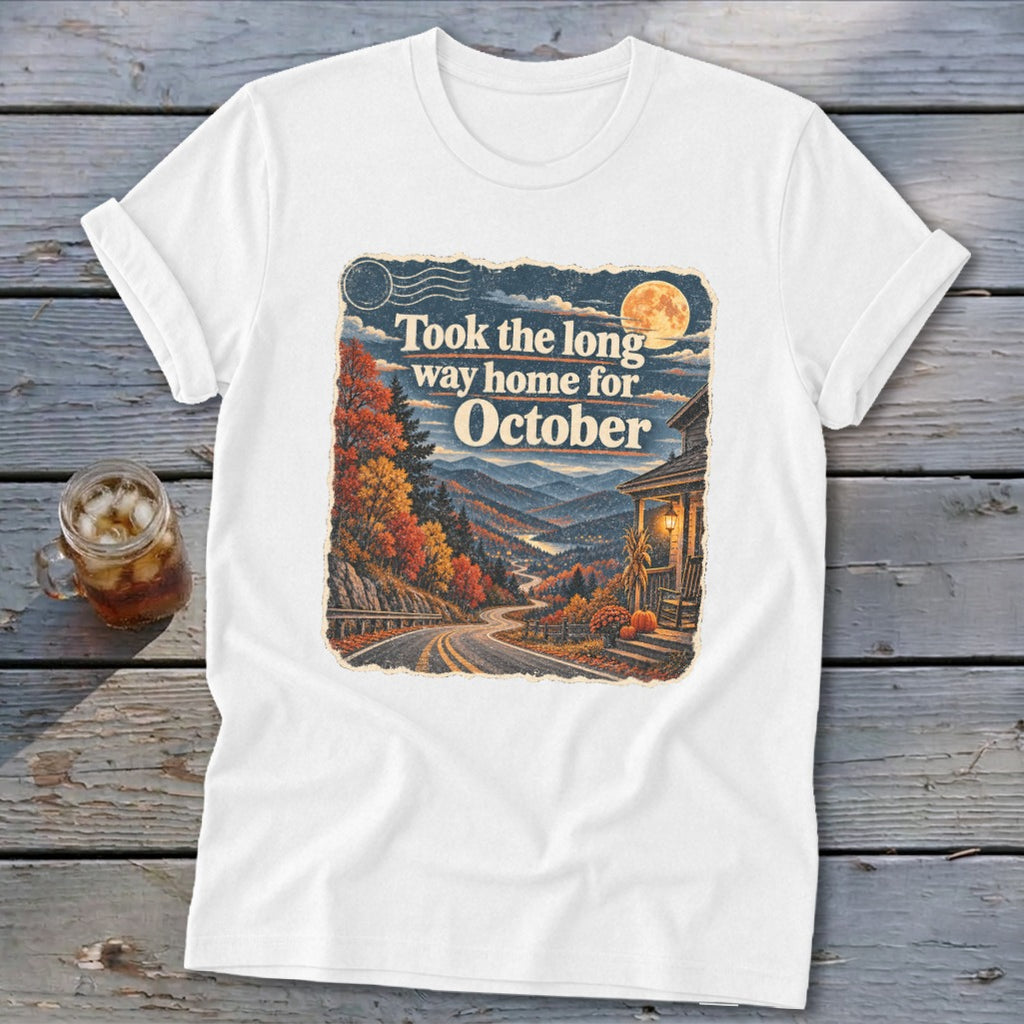 White t-shirt with "Took the long way home for October" text and autumn mountain scene.