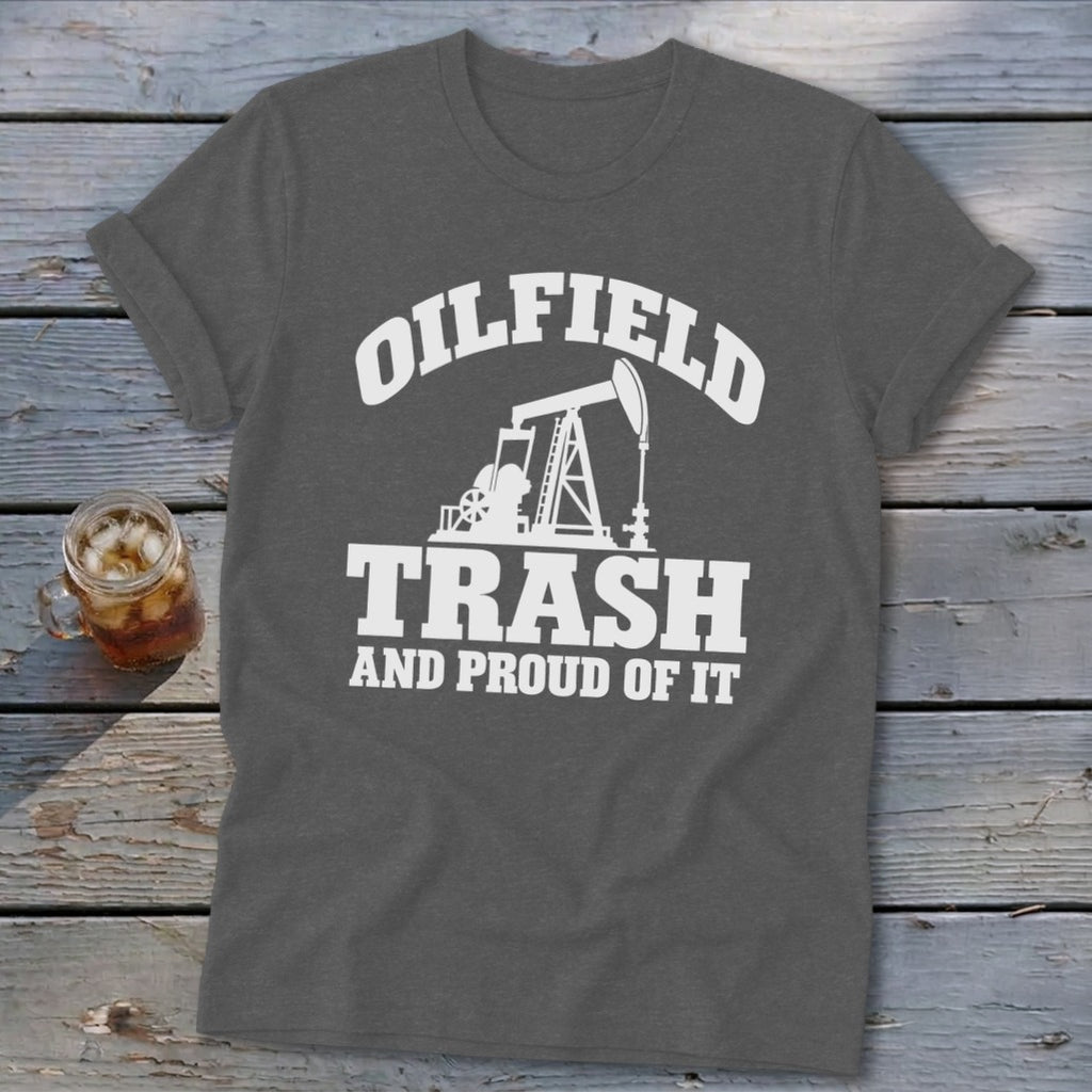 Dark grey t-shirt with white text and oil rig graphic reading "Oilfield Trash And Proud Of It".