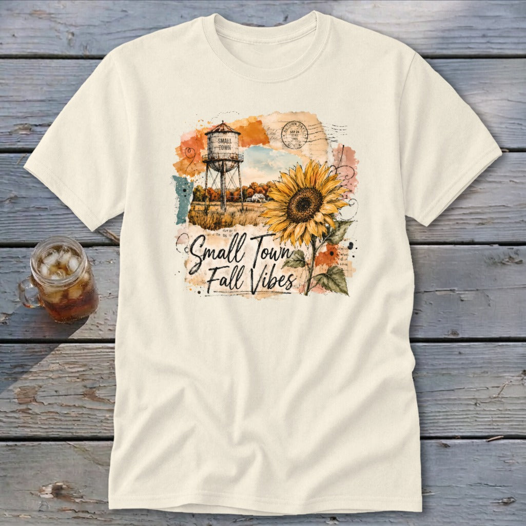 Cream t-shirt with "Small Town Fall Vibes" graphic and sunflower.
