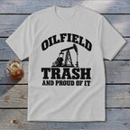 White t-shirt with black graphic: "OILFIELD TRASH AND PROUD OF IT" and pumpjack.