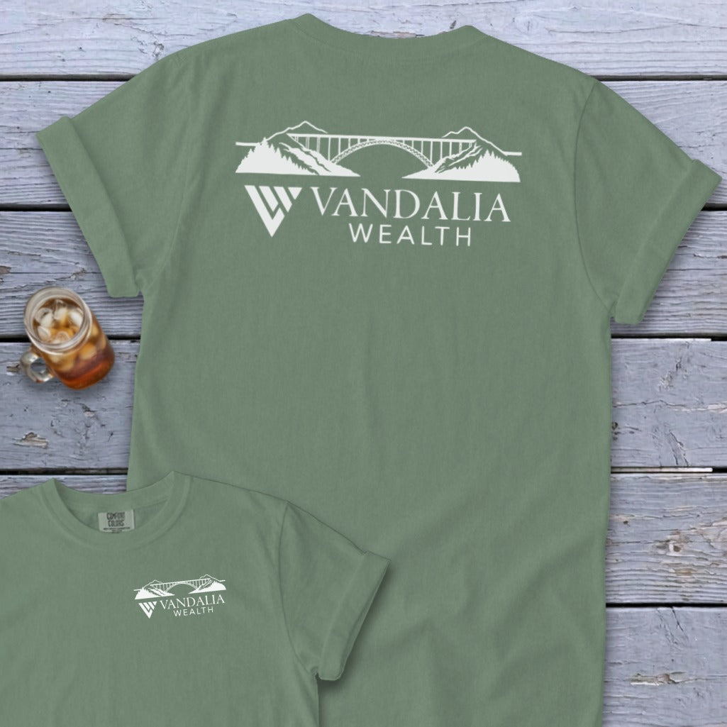 Green t-shirt with Vandalia Wealth logo featuring a bridge and mountains.