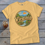 Yellow t-shirt with circular graphic of a deer, river, and mountains with "Virginia" text.
