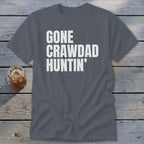 Gray t-shirt with white text that reads "GONE CRAWDAD HUNTIN'".