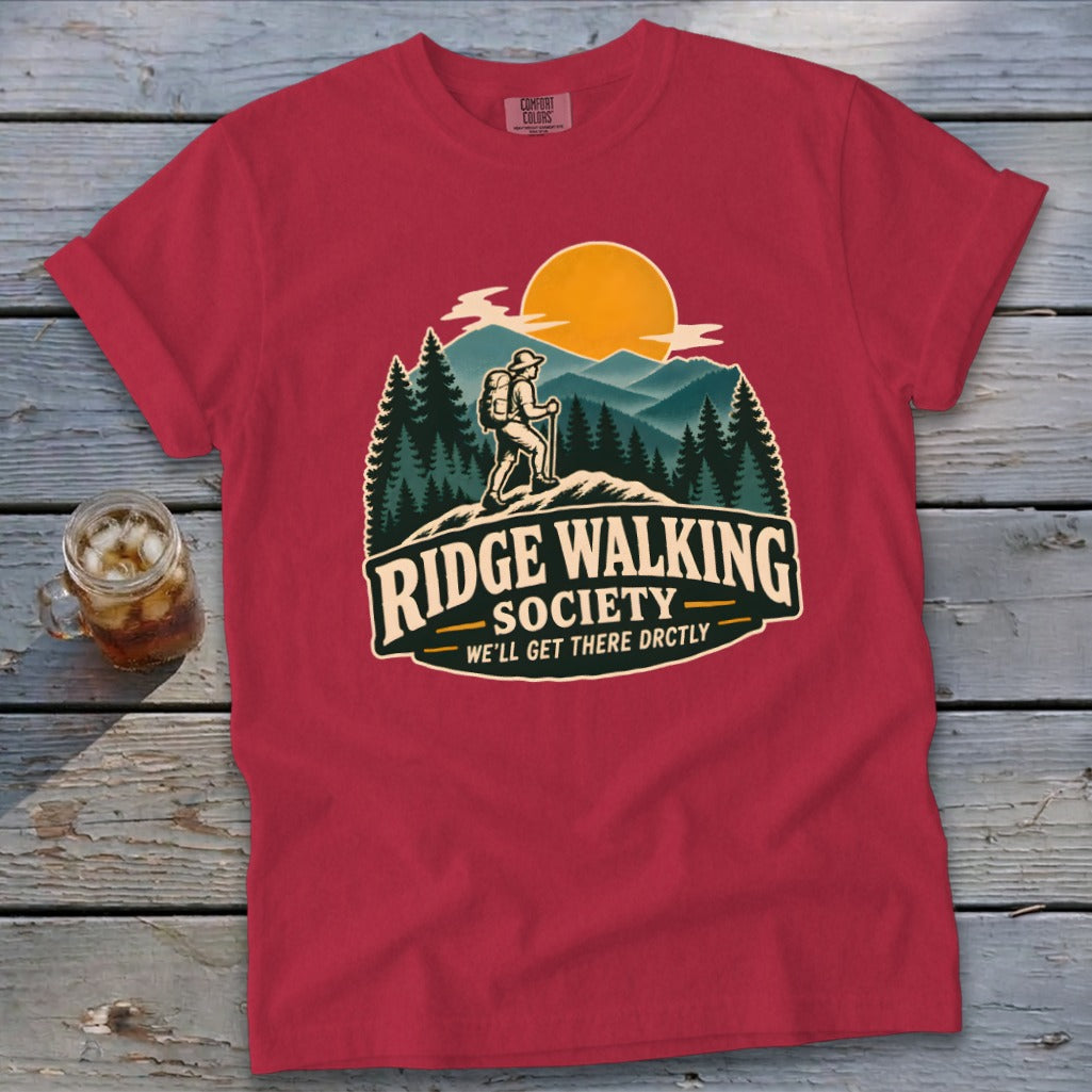 Red t-shirt with "Ridge Walking Society" graphic of a hiker and mountains.
