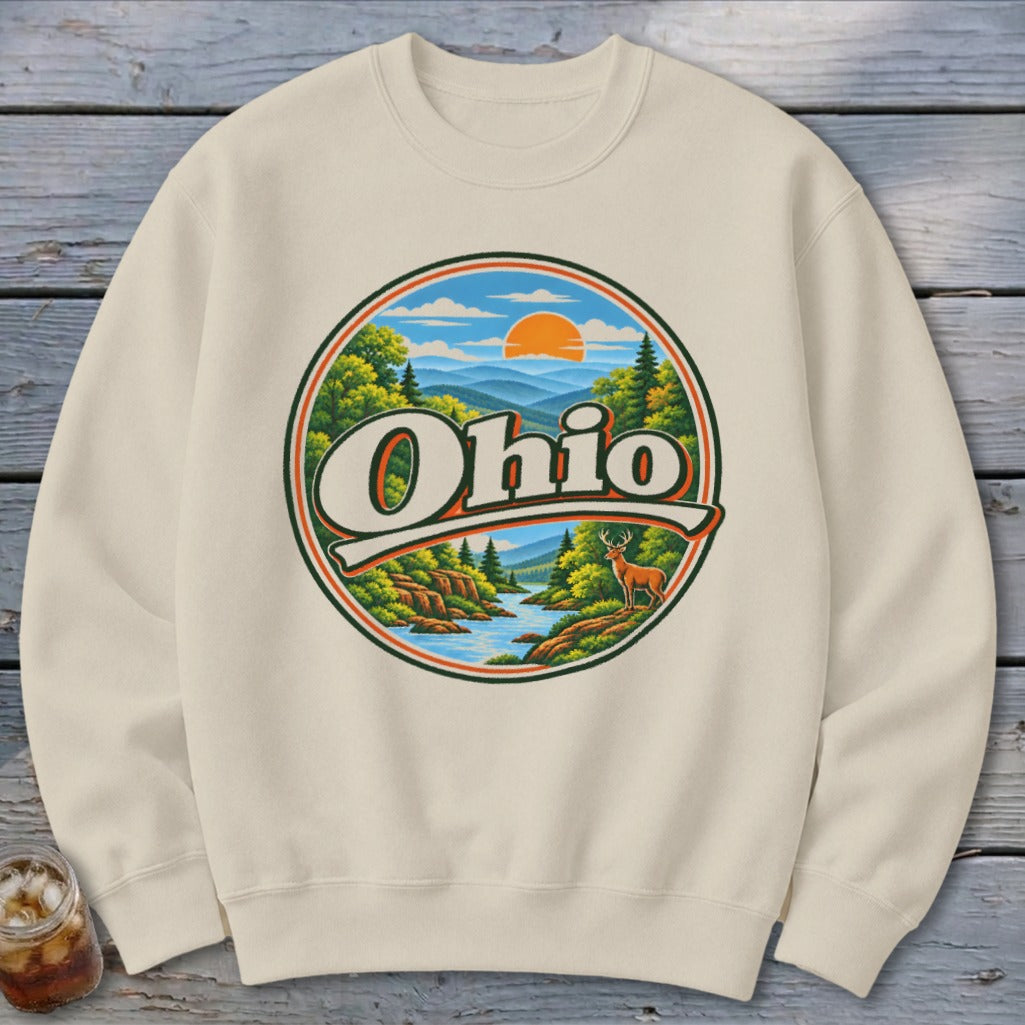 Cream sweatshirt featuring a circular graphic of Ohio with a landscape and a deer.
