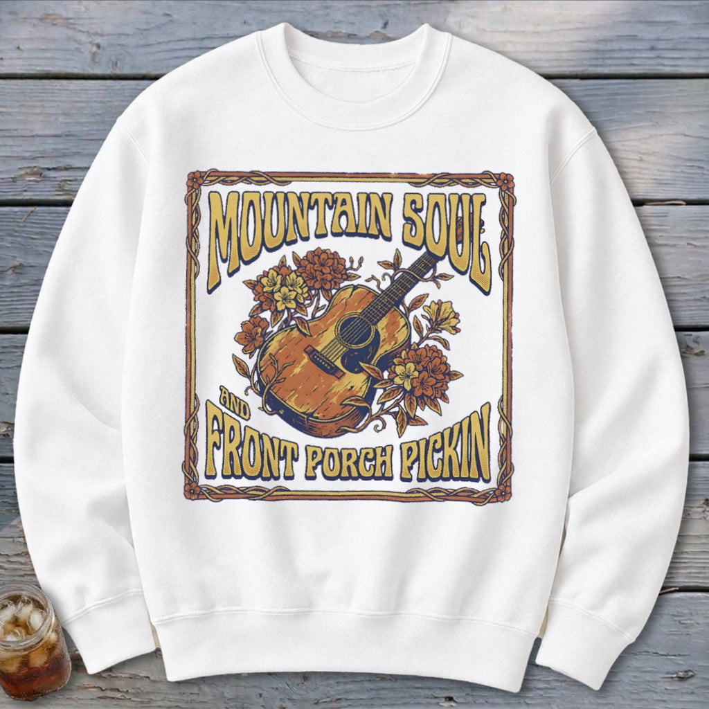 White sweatshirt with "Mountain Soul" and "Front Porch Pickin'" text and guitar.