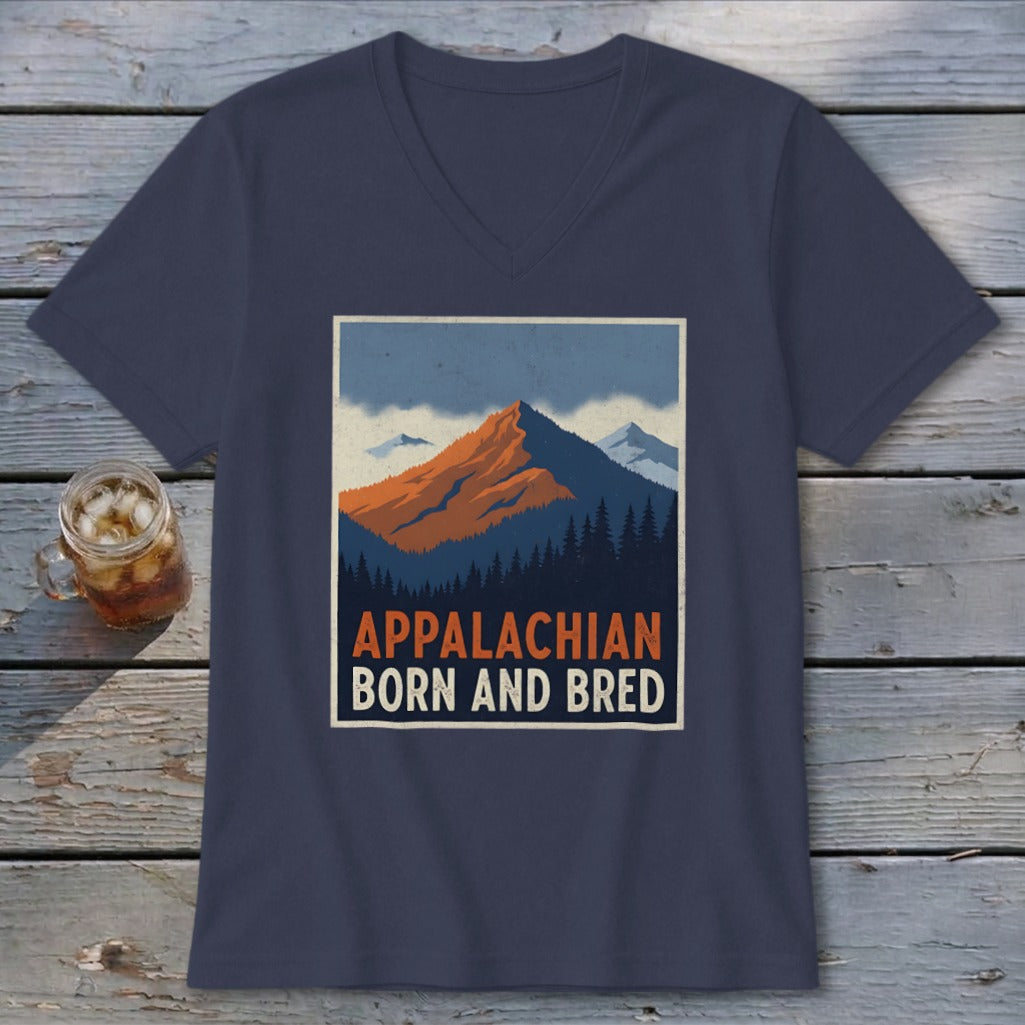 A navy blue V-neck t-shirt featuring a retro graphic of mountains and the text Appalachian Born and Bred.