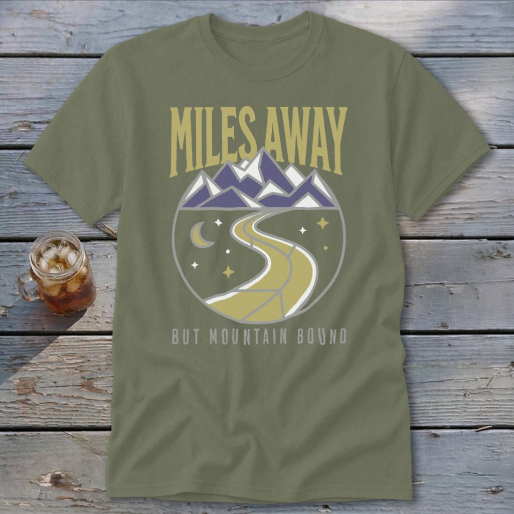 Olive green t-shirt with "Miles Away But Mountain Bound" text and mountain graphic.
