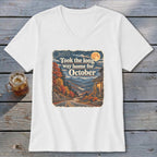 White v-neck t-shirt with "Took the long way home for October" graphic.