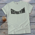 Pale green t-shirt with black text that says "GUESS WHERE I'M FROM".