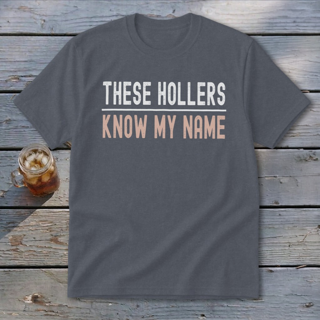 Gray t-shirt with "THESE HOLLERS KNOW MY NAME" text in white and pink.