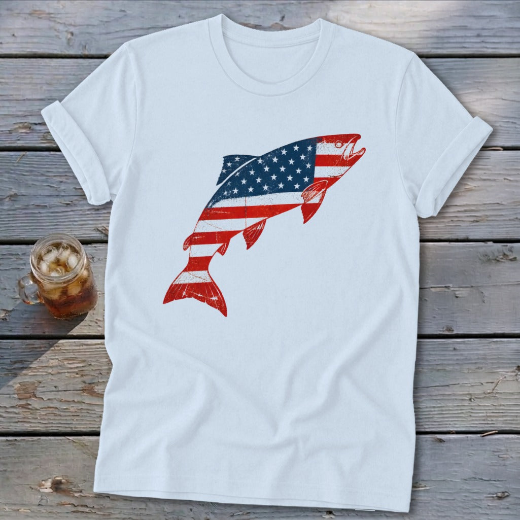 A white t-shirt featuring a jumping fish graphic patterned with the American flag.