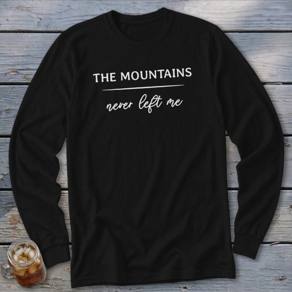 Black long sleeve shirt with "The Mountains never left me" text in white.