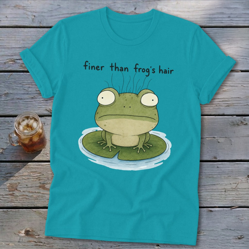 Teal t-shirt featuring a green frog on a lily pad with the text finer than frog's hair.
