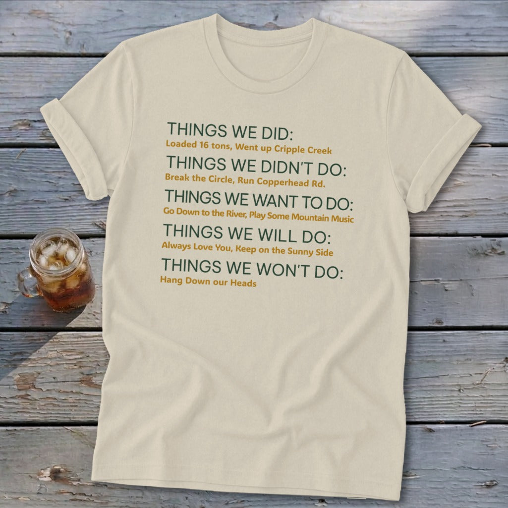 Cream t-shirt with green and orange text listing "Things We Did," "Didn't Do," "Want to Do," "Will Do," and "Won't Do."