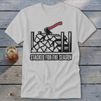 White t-shirt with graphic of chopped wood, axe, and text "STACKED FOR THE SEASON".