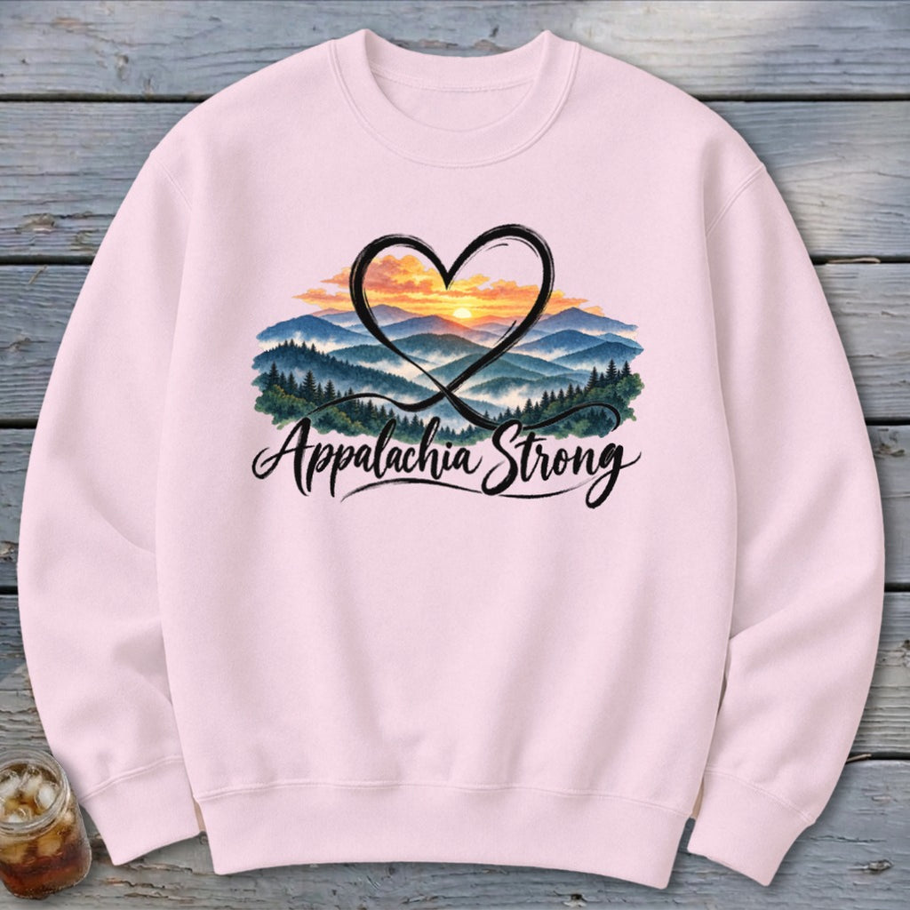Pink sweatshirt with a heart framing a mountain sunrise and the text "Appalachia Strong."