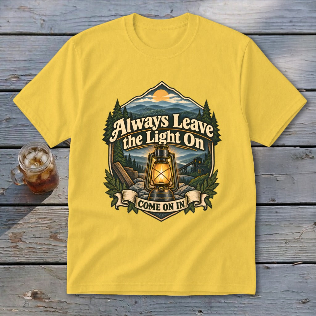 Yellow t-shirt with "Always Leave the Light On Come On In" text and lantern graphic.
