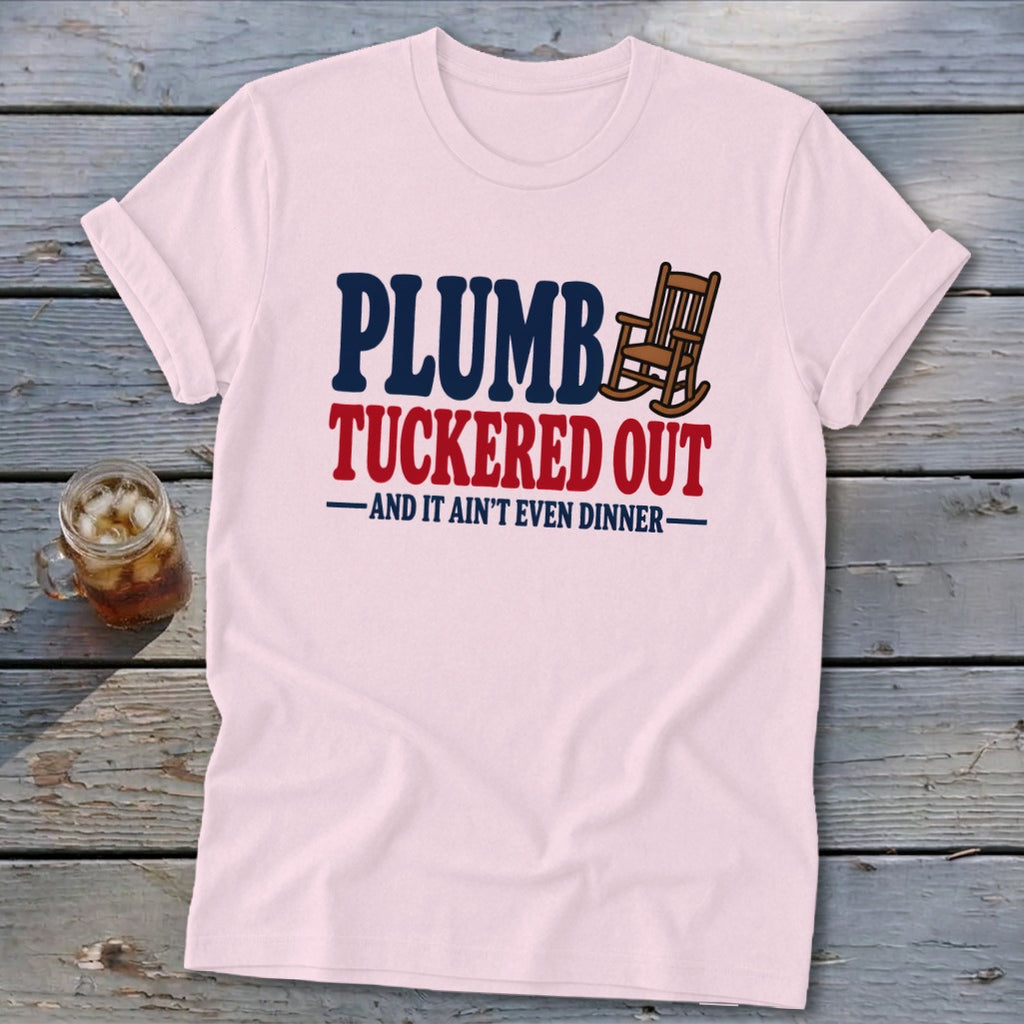 Pink t-shirt with "PLUMB TUCKERED OUT AND IT AIN'T EVEN DINNER" text and rocking chair.