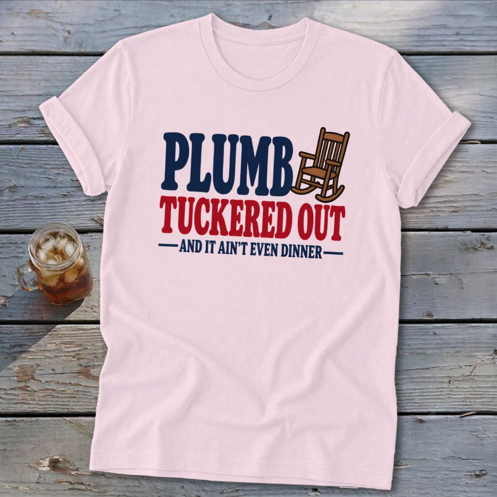 Pink t-shirt with "PLUMB TUCKERED OUT AND IT AIN'T EVEN DINNER" text and rocking chair.