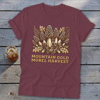 Maroon t-shirt with illustration of morel mushrooms, leaves, acorns, and text.