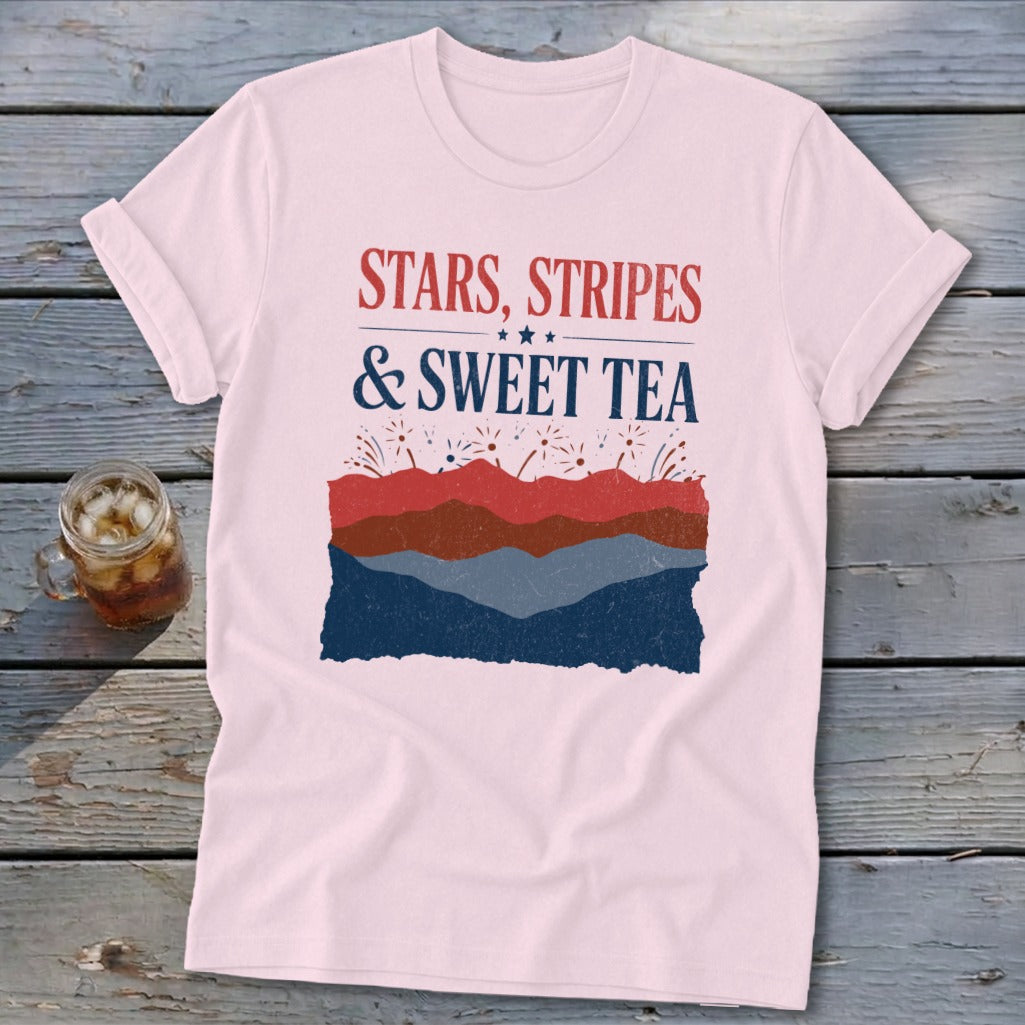 Light pink t-shirt with red and blue graphic text reading Stars, Stripes & Sweet Tea.