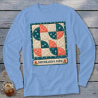 Long sleeve light blue shirt with a quilt design and "Drunkard's Path" text.