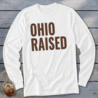 White long-sleeve shirt with "OHIO RAISED" printed in brown text.