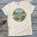 Cream t-shirt with circular West Virginia mountain river and deer graphic.