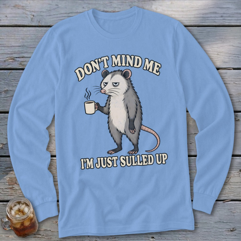 Light blue long-sleeve shirt with possum holding coffee and text "Don't mind me, I'm just sulled up."