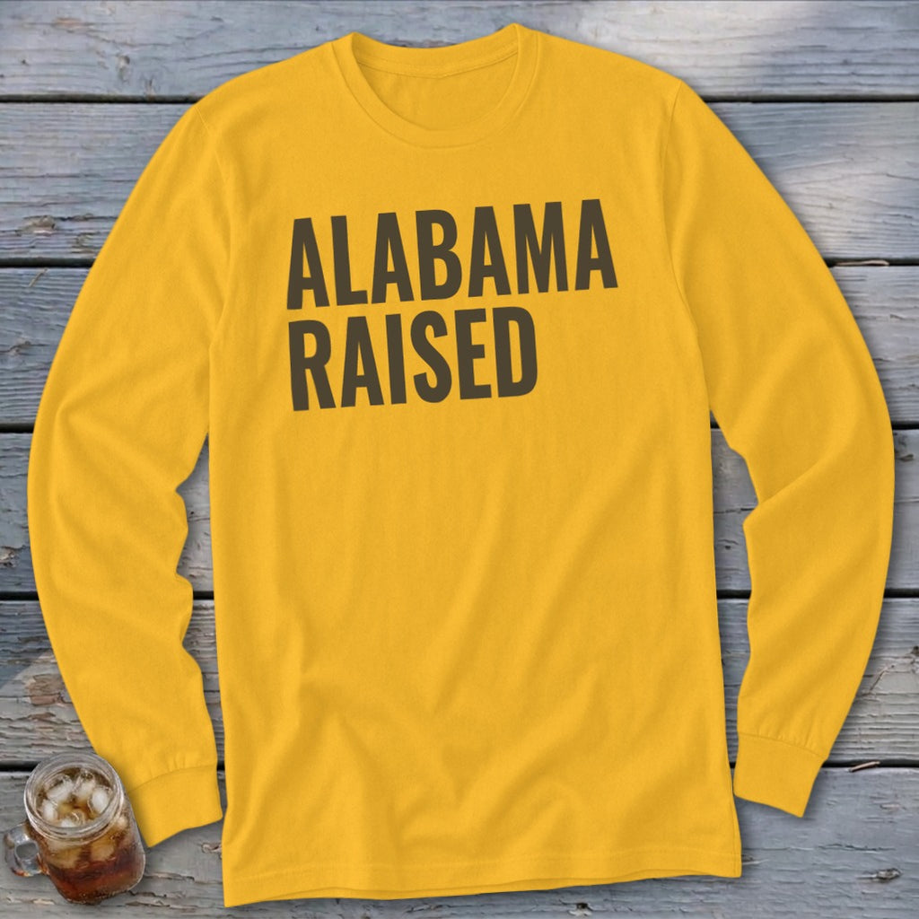 Yellow long sleeve t-shirt with "ALABAMA RAISED" text in dark grey.