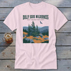 Light pink t-shirt featuring a green graphic of Dolly Sods Wilderness with pine trees and mountains.