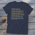 Navy t-shirt with white text listing "Things We Did," "Didn't Do," "Want To Do," "Will Do," and "Won't Do."