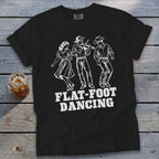 Black t-shirt with white graphic of three dancers and "FLAT-FOOT DANCING" text.