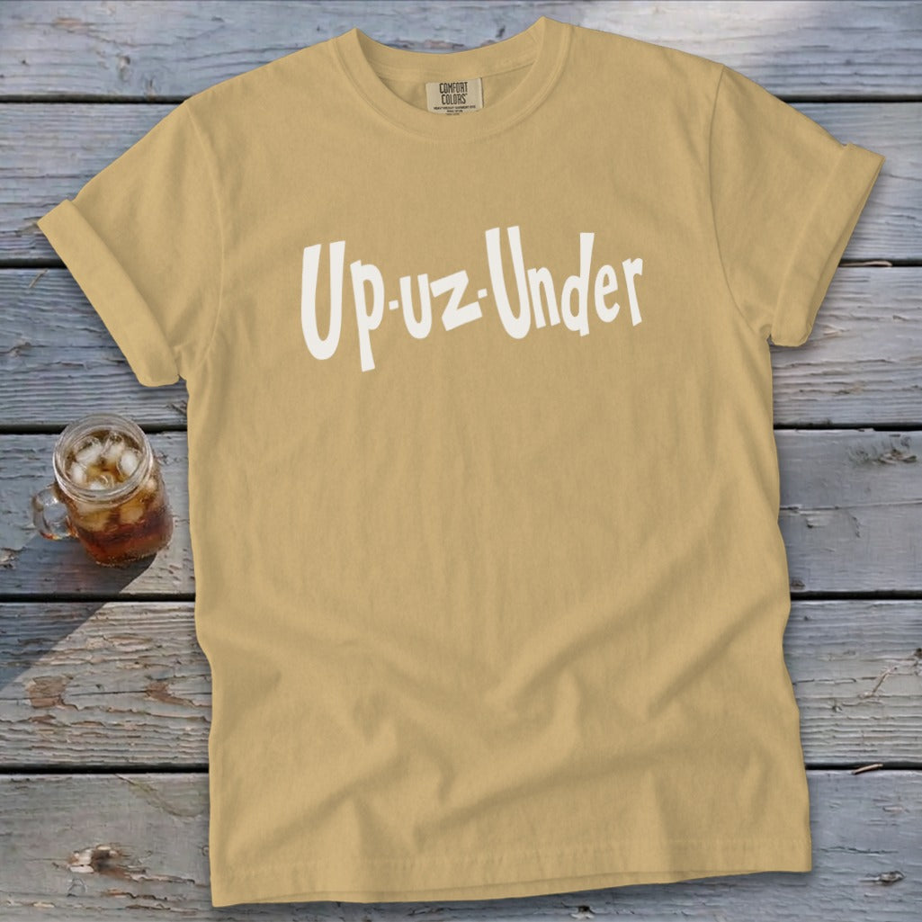 Tan t-shirt with white "Up-uz-Under" text and a glass of iced drink.