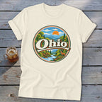 Cream t-shirt with a circular Ohio nature graphic featuring a river, deer, and mountains.