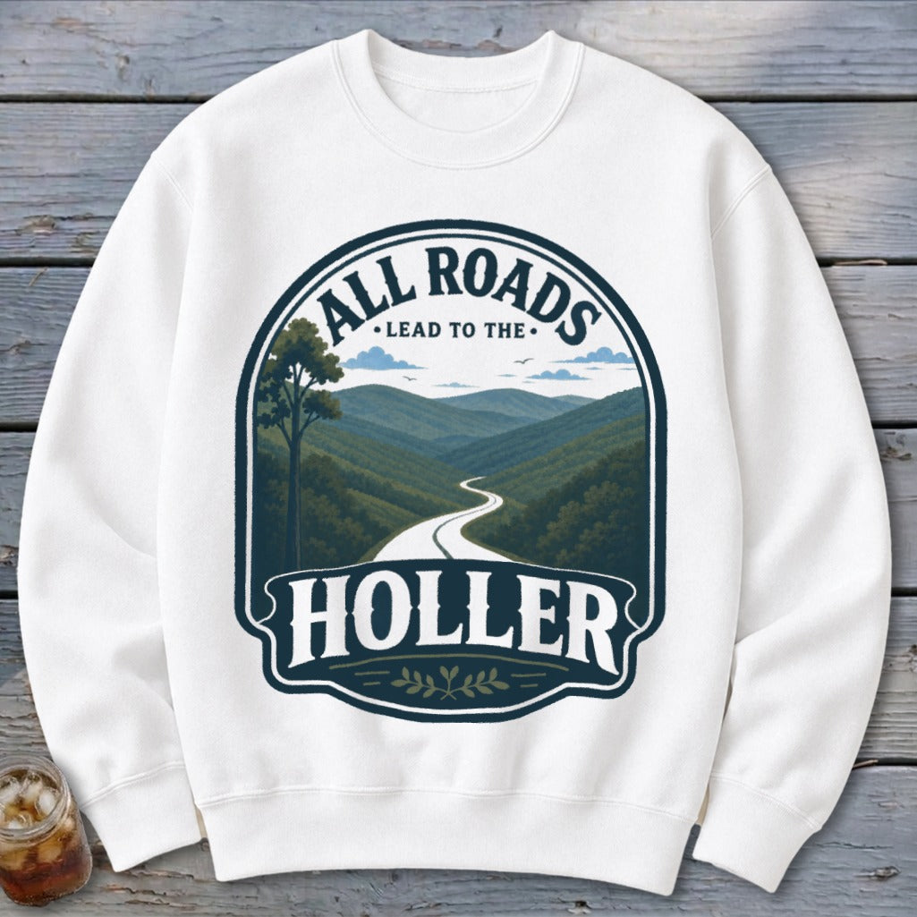 White sweatshirt with "All Roads Lead to the Holler" text and mountain landscape graphic.