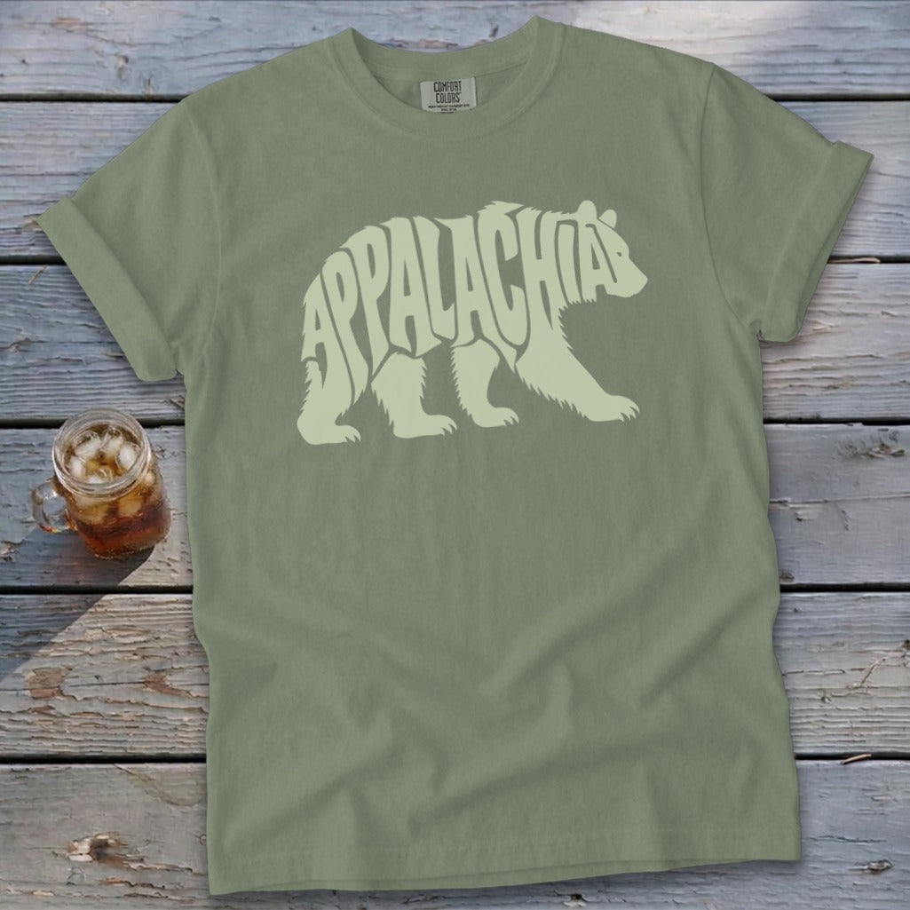 An olive green t-shirt with a light green graphic of a bear containing the text Appalachia.