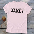 Pink t-shirt with black text reading "LOOKING A LITTLE JAKEY".