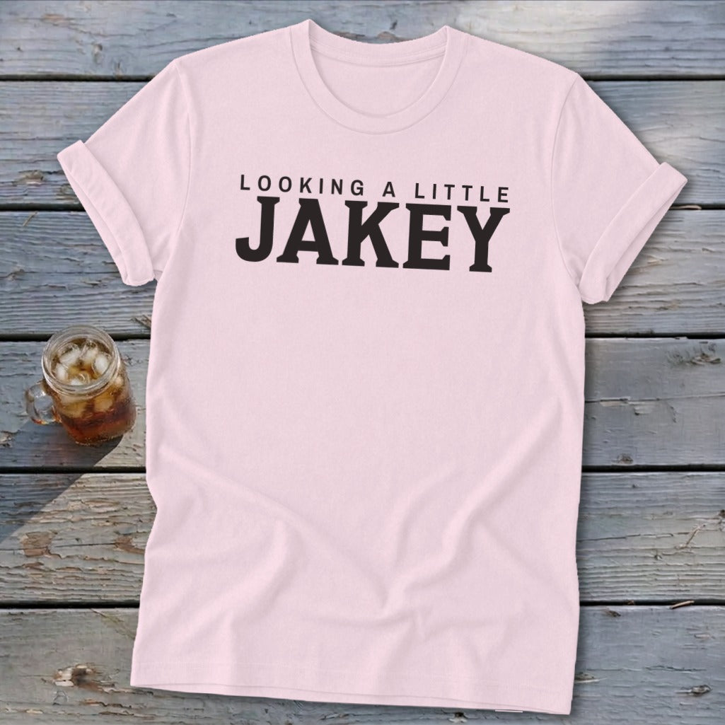 Pink t-shirt with black text reading "LOOKING A LITTLE JAKEY".