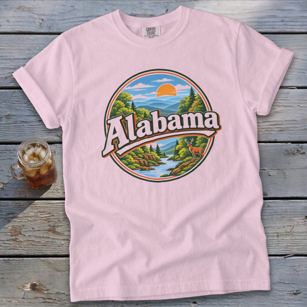 Pink t-shirt with a circular graphic of Alabama scenery and a deer.