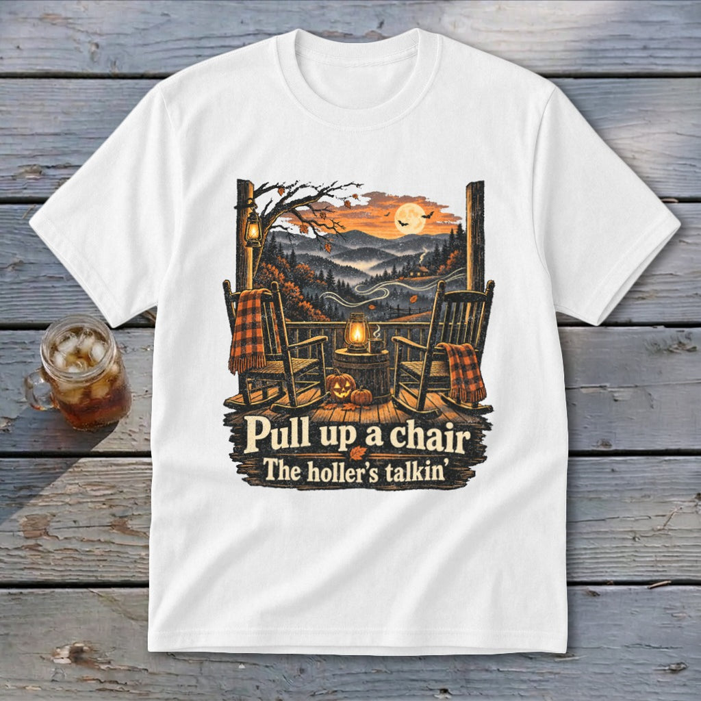 White t-shirt with porch scene, rocking chairs, pumpkins, and text "Pull up a chair The holler's talkin'".