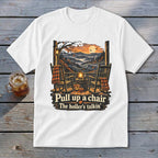 White t-shirt with porch scene, rocking chairs, pumpkins, and text "Pull up a chair The holler's talkin'".