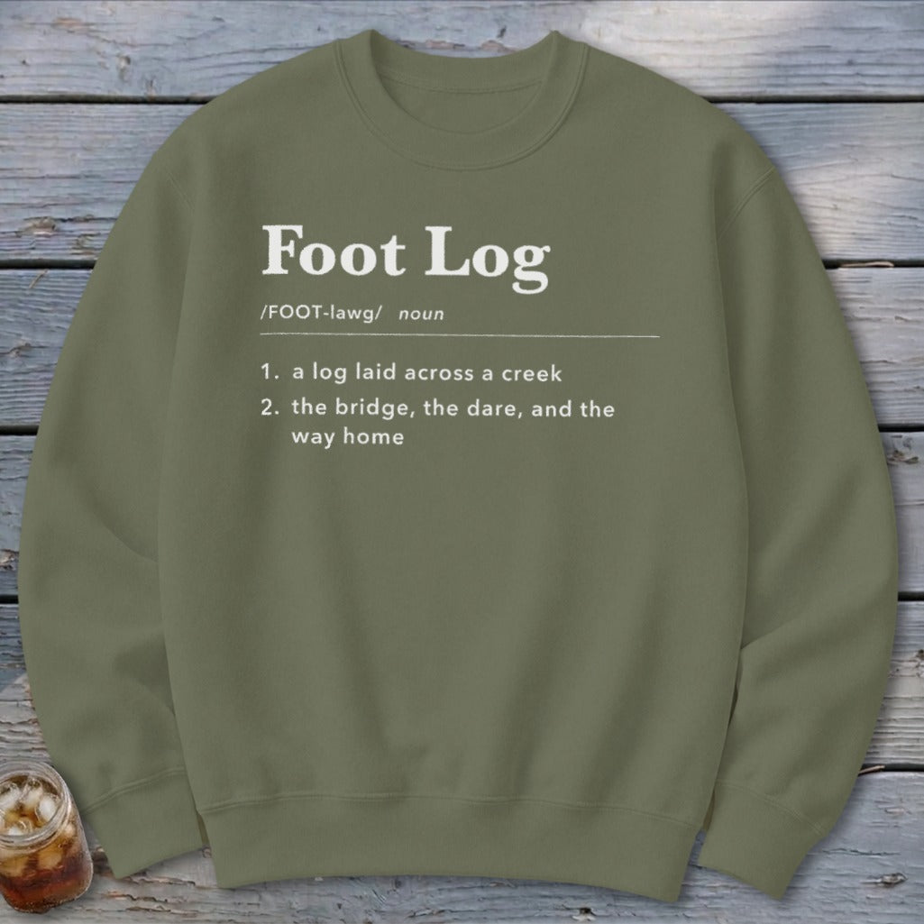 An olive green crewneck sweatshirt with the definition of Foot Log printed in white.
