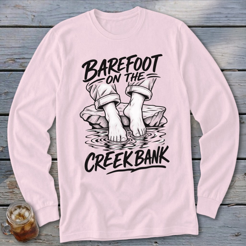 Long sleeve pink shirt with "Barefoot on the Creek Bank" text and graphic.