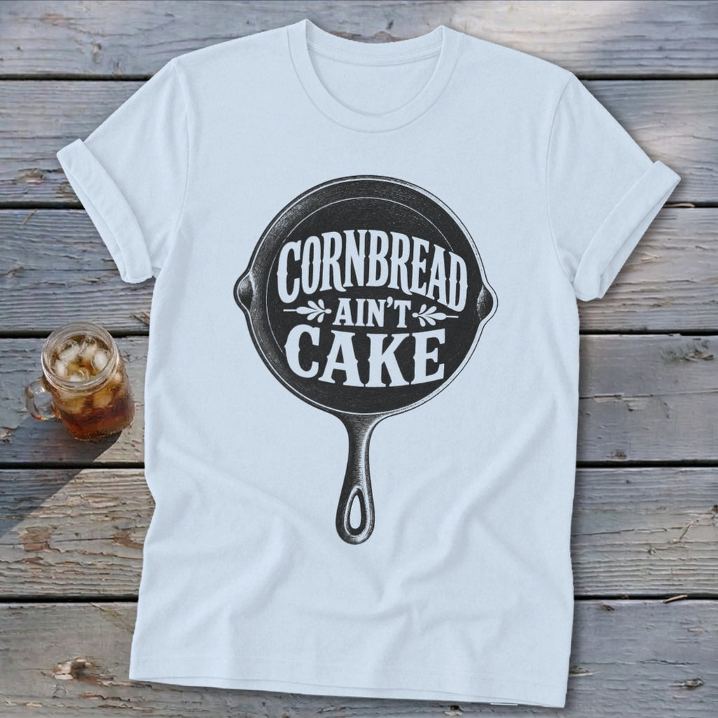 White t-shirt with cast iron skillet graphic saying "Cornbread Ain't Cake".