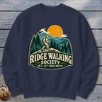 Navy sweatshirt with "Ridge Walking Society" graphic featuring a hiker and mountains.