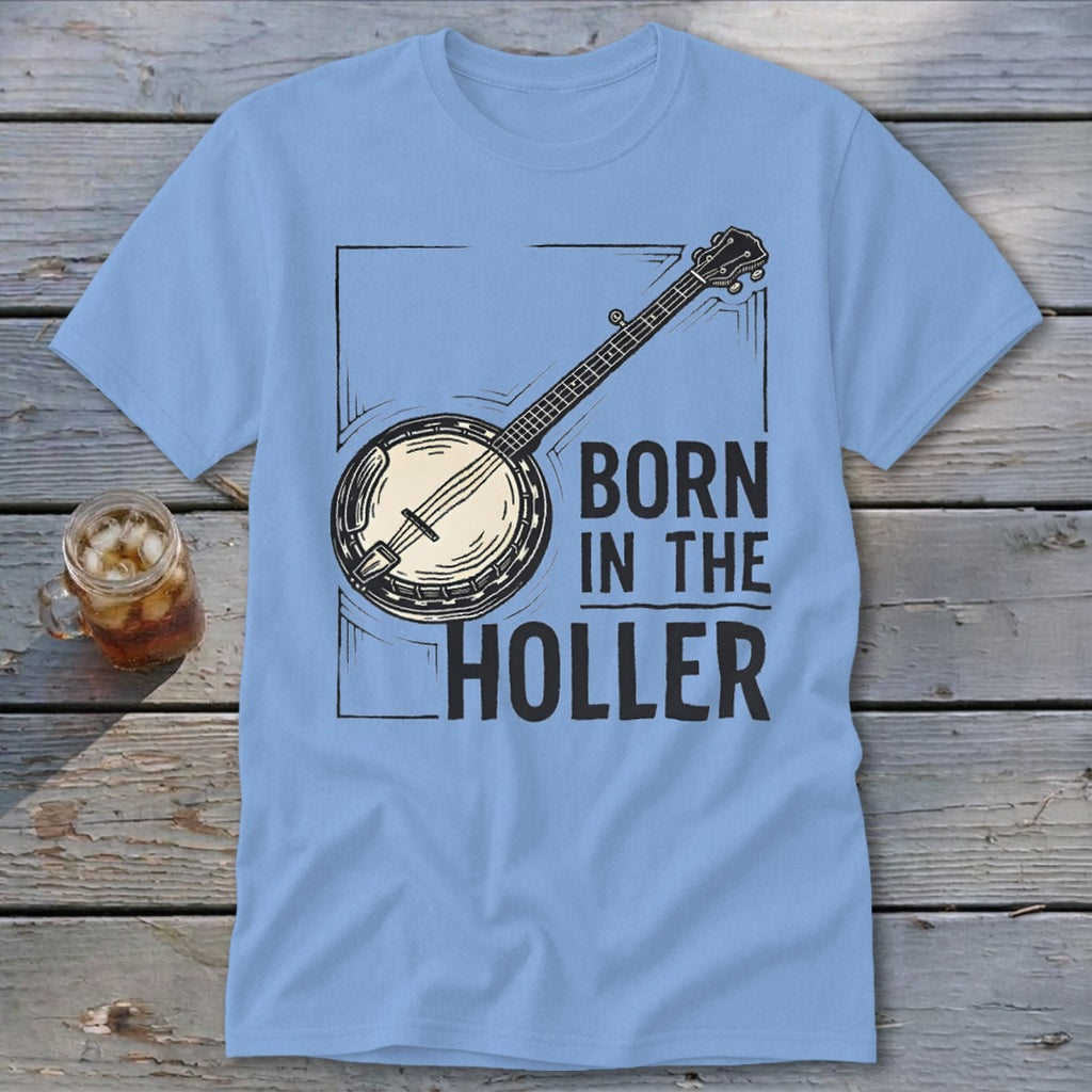 Light blue t-shirt with banjo graphic and text "BORN IN THE HOLLER".