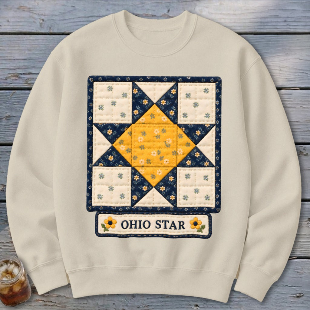 Cream sweatshirt with a quilted Ohio Star design and floral accents.